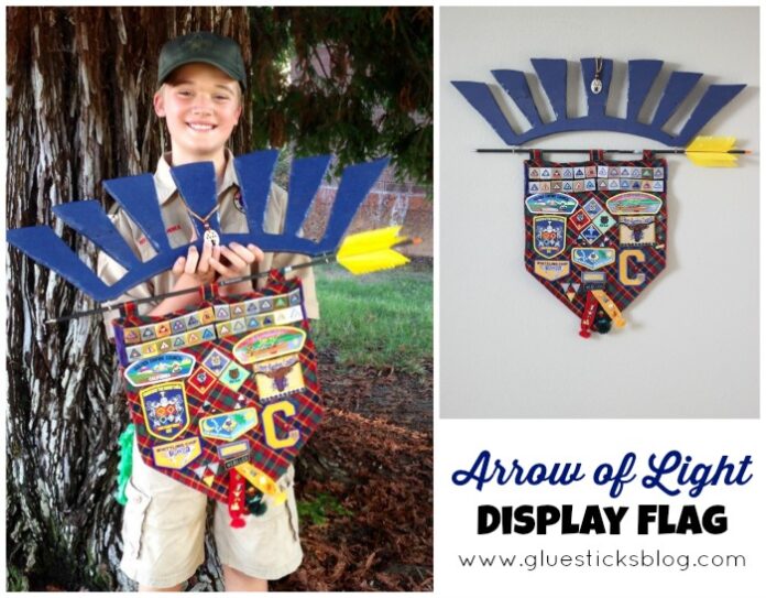 boy holding Arrow of Light Display Flag